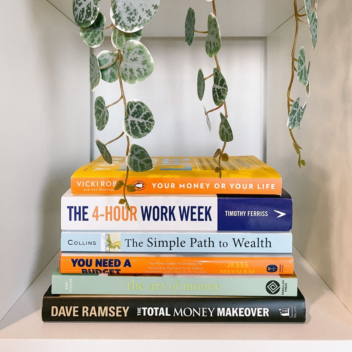 A stack of the best personal finance books on a shelf